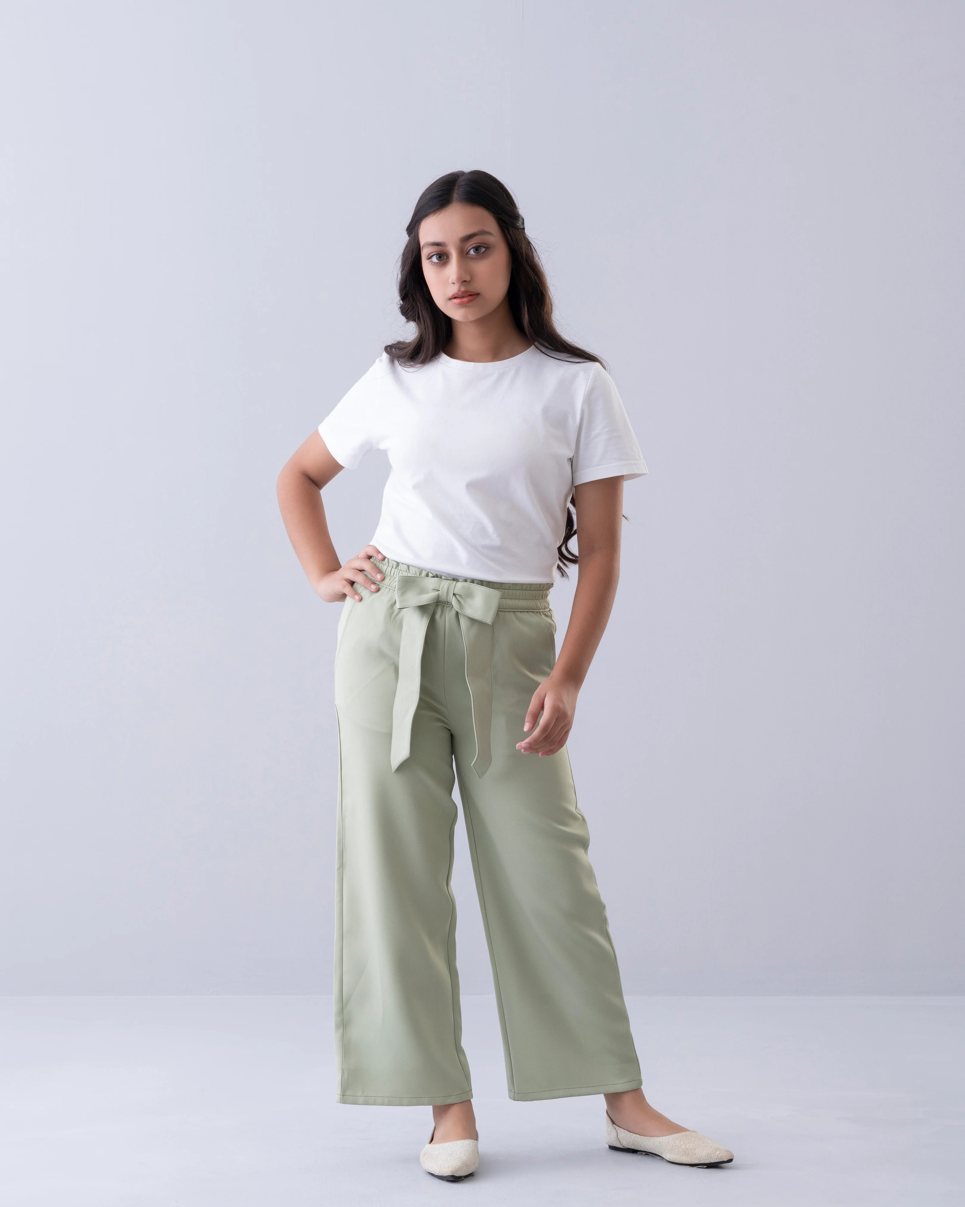 Girl wearing light green bottom items