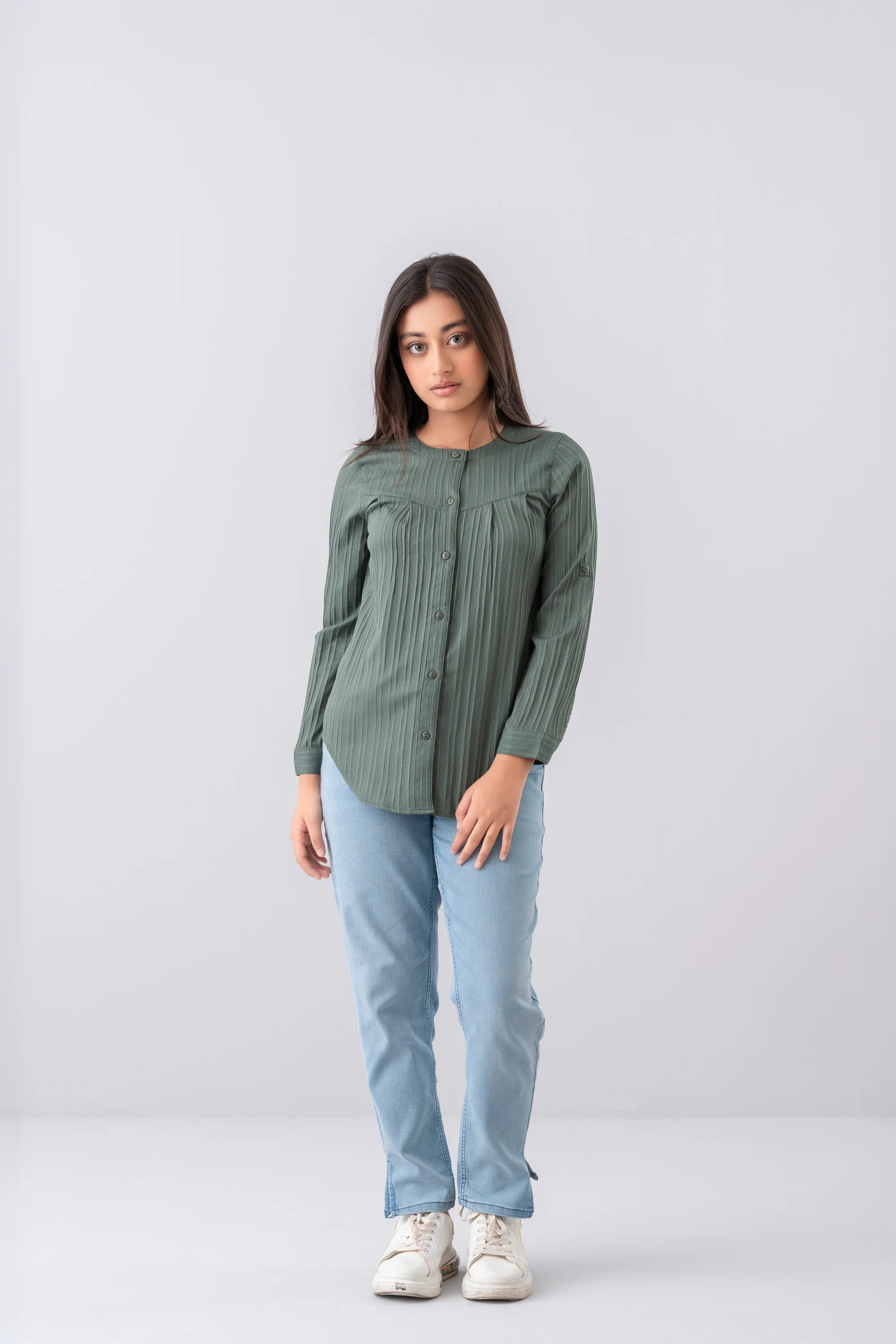 Girl wearing a green long-sleeve top