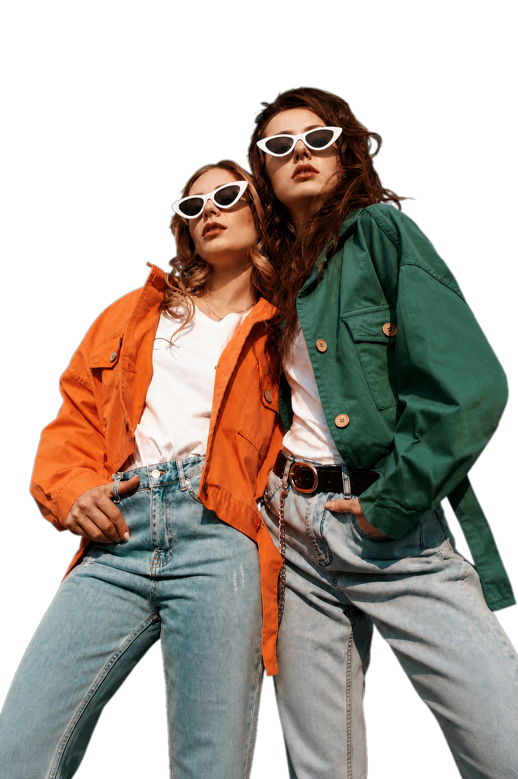 Two fashion models wearing orange and green jackets with denim